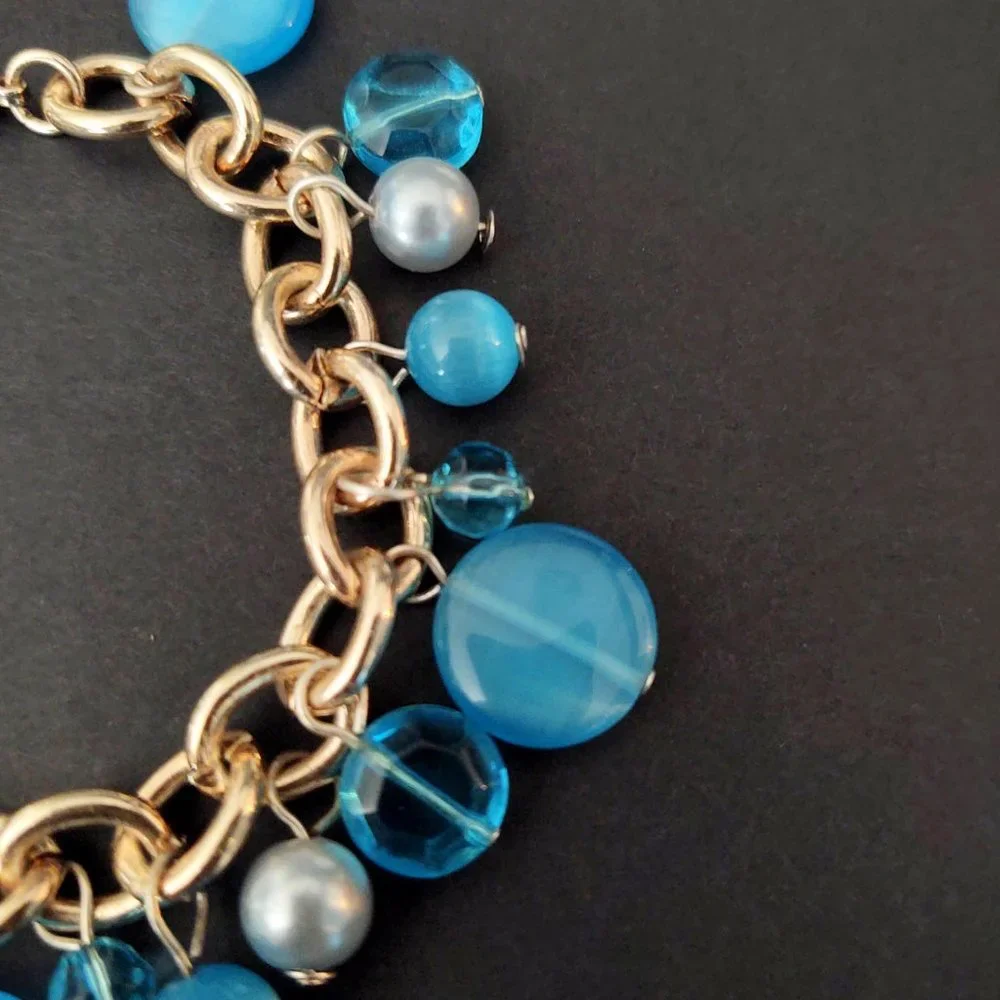 Blue bead and faux pearl charm style bracelet